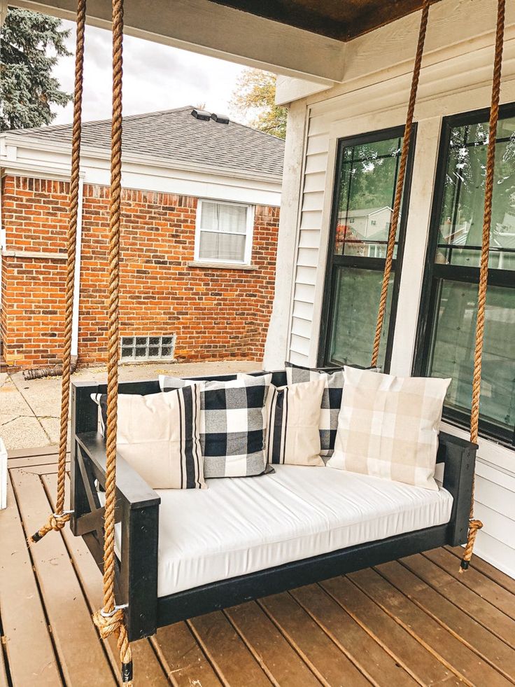 Here are 25 farmhouse porch swings for a welcoming and cozy entry way! All the farmhouse porch swing ideas you need in one place!