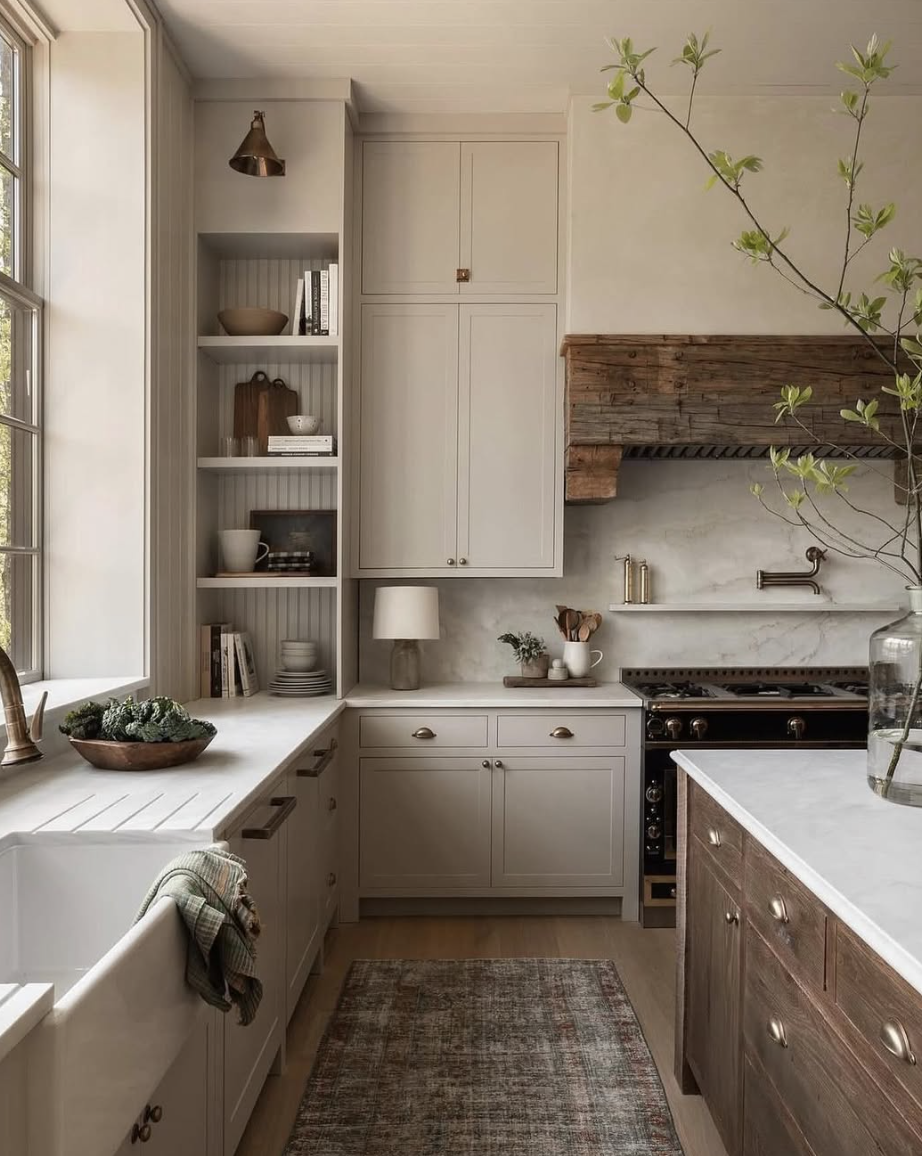 rustic wood farmhouse range hood with neutral cabinets and marble backsplash