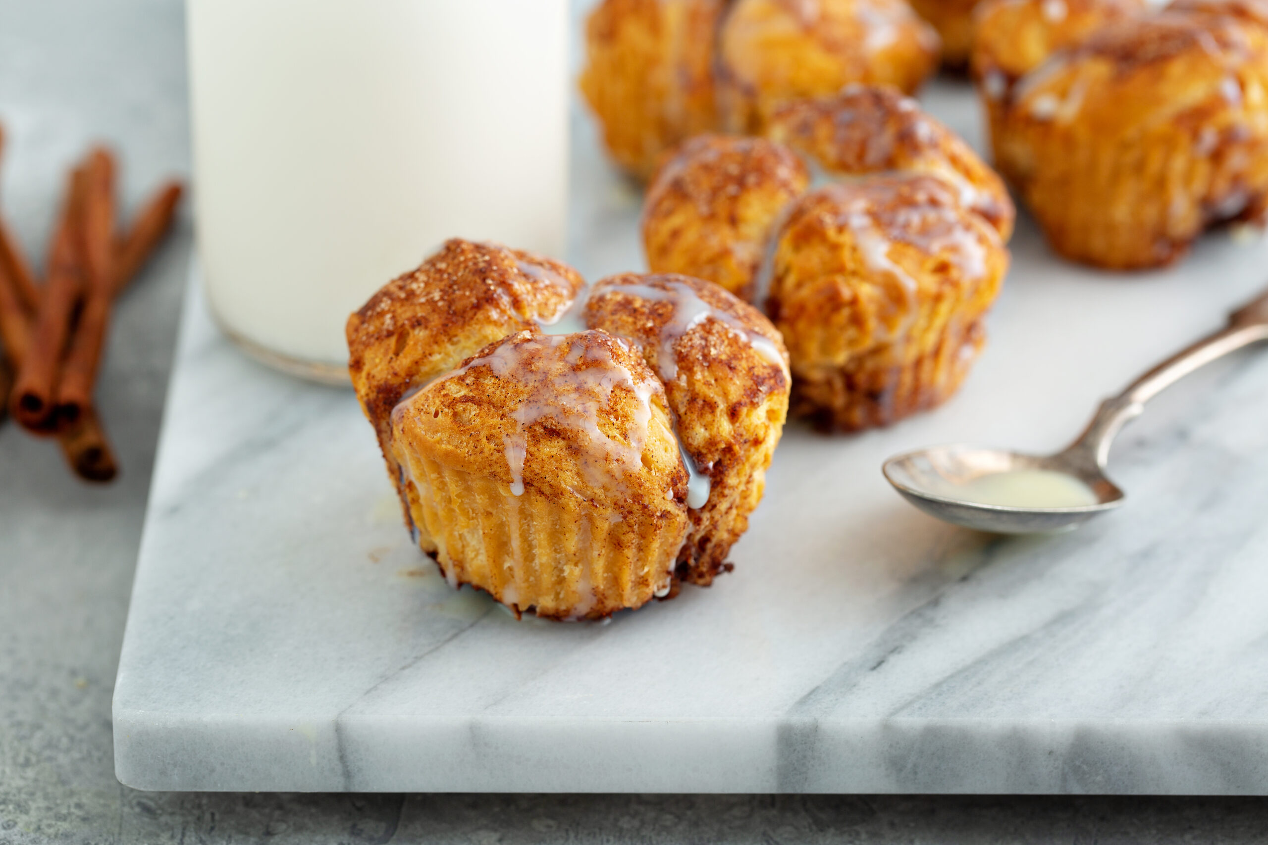 Cinnamon Monkey Bread Muffins Recipe; these sweet and fluffy pull apart muffins, bursting with cinnamon flavors will be one your family asks for every holiday season!