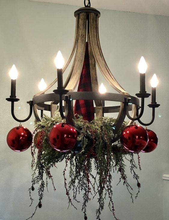 Chandelier Christmas Decor Ideas; a list of 40 festive chandelier Christmas decor ideas that are sure to add some sparkle to your dining room this holiday season! 