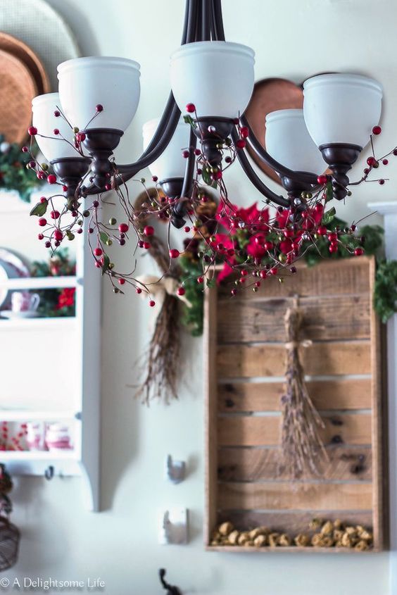 Chandelier Christmas Decor Ideas; a list of 40 festive chandelier Christmas decor ideas that are sure to add some sparkle to your dining room this holiday season!