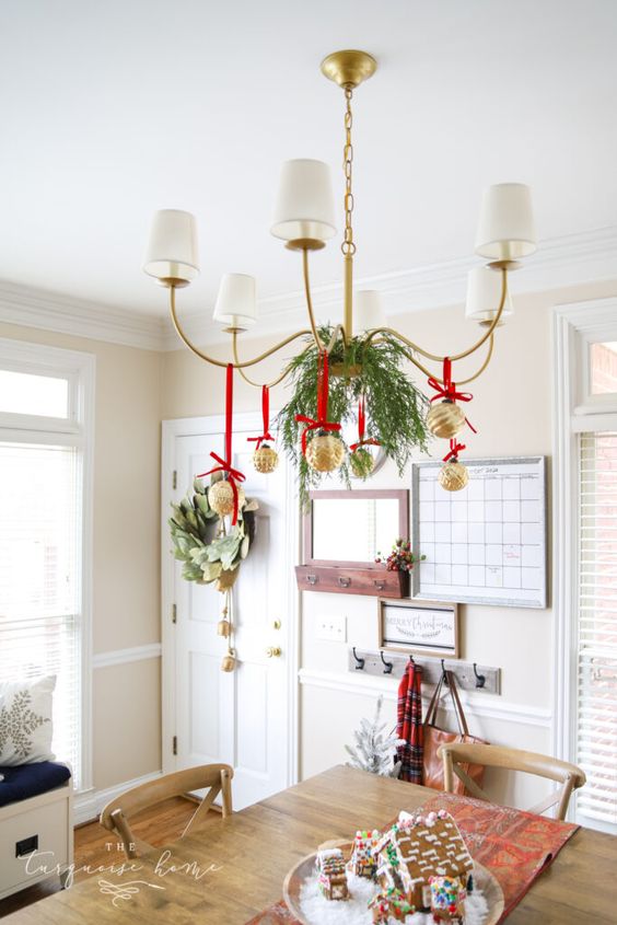 Chandelier Christmas Decor Ideas; a list of 40 festive chandelier Christmas decor ideas that are sure to add some sparkle to your dining room this holiday season!