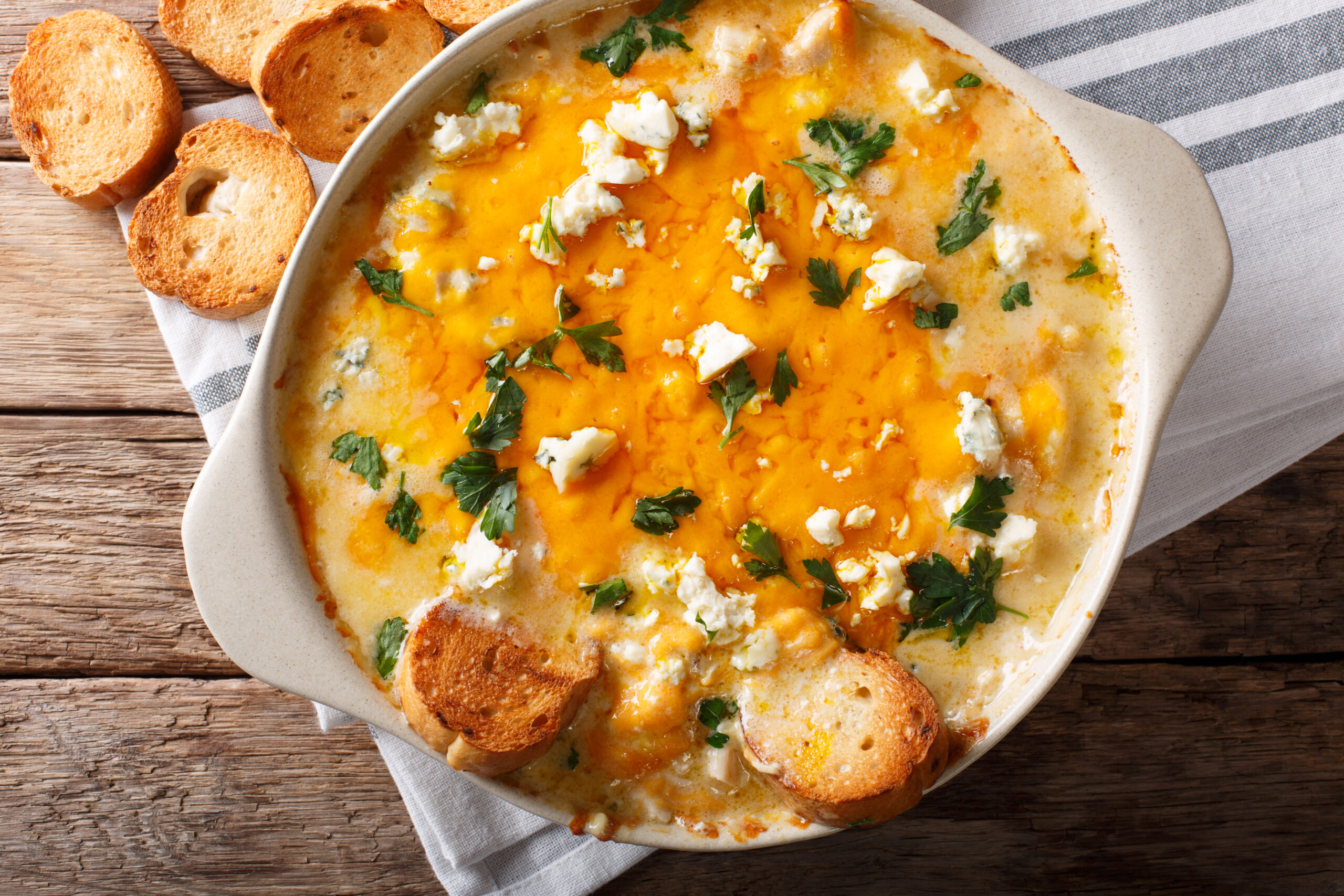 Cheesy Buffalo Chicken Dip Recipe; A delicious appetizer for parties and family get togethers. Every Super Bowl party needs a big pot of this creamy and spicy buffalo chicken dip. 