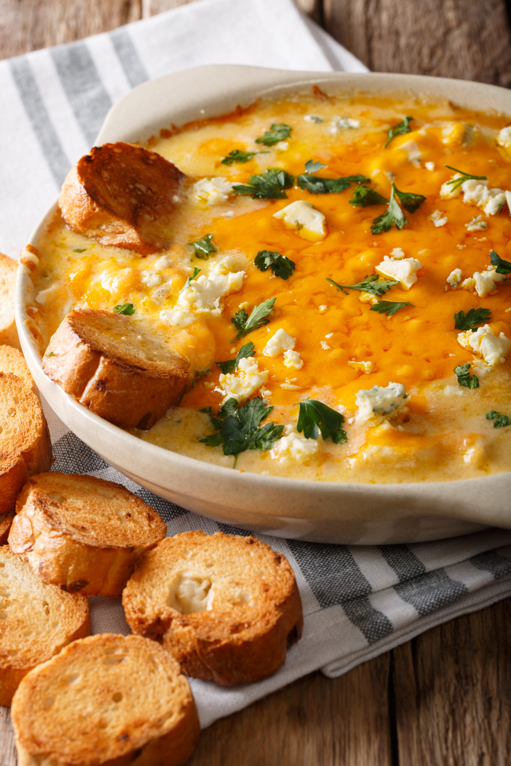 Cheesy Buffalo Chicken Dip Recipe; A delicious appetizer for parties and family get togethers. Every Super Bowl party needs a big pot of this creamy and spicy buffalo chicken dip. 