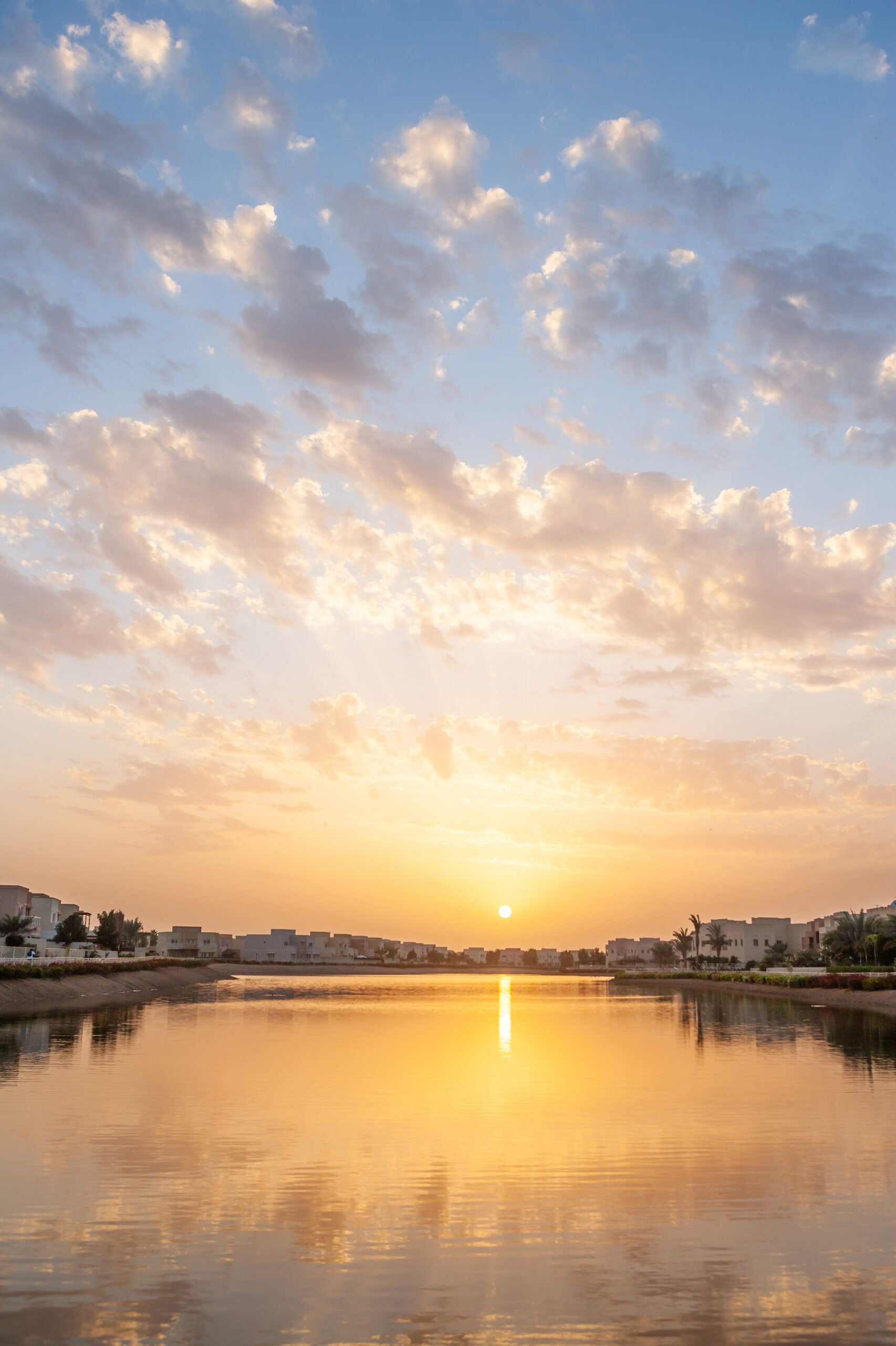 Sunset over a lake at Emirates Hills in Dubai in the United Arab Emirates. 
 Interior and Exterior of the Most Beautiful Villas in Dubai 