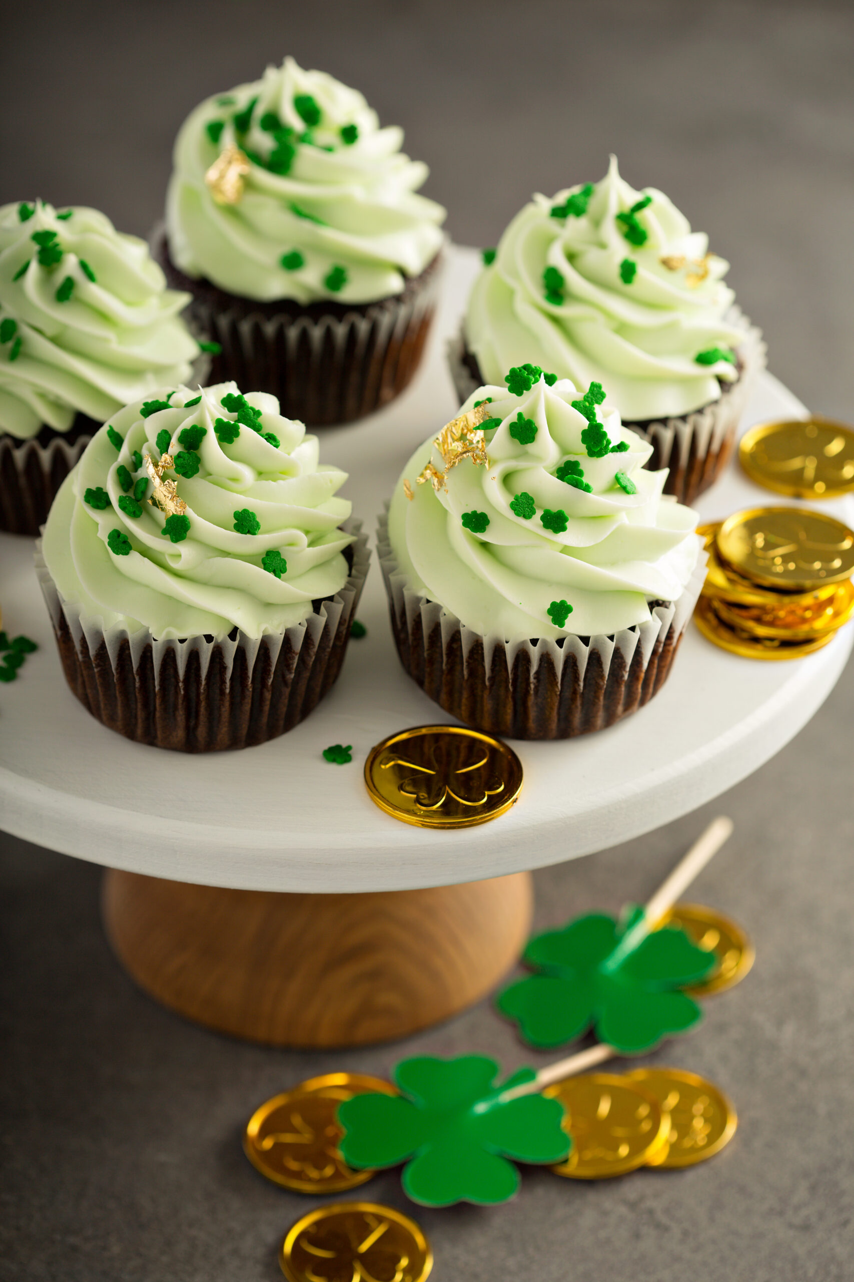 Saint Patrick day chocolate mint cupcakes with green frosting and golden leaf - Top 10 St. Patrick's Day Dessert Recipes; St. Patrick's day recipes for desserts along with other green recipes for this Irish holiday!