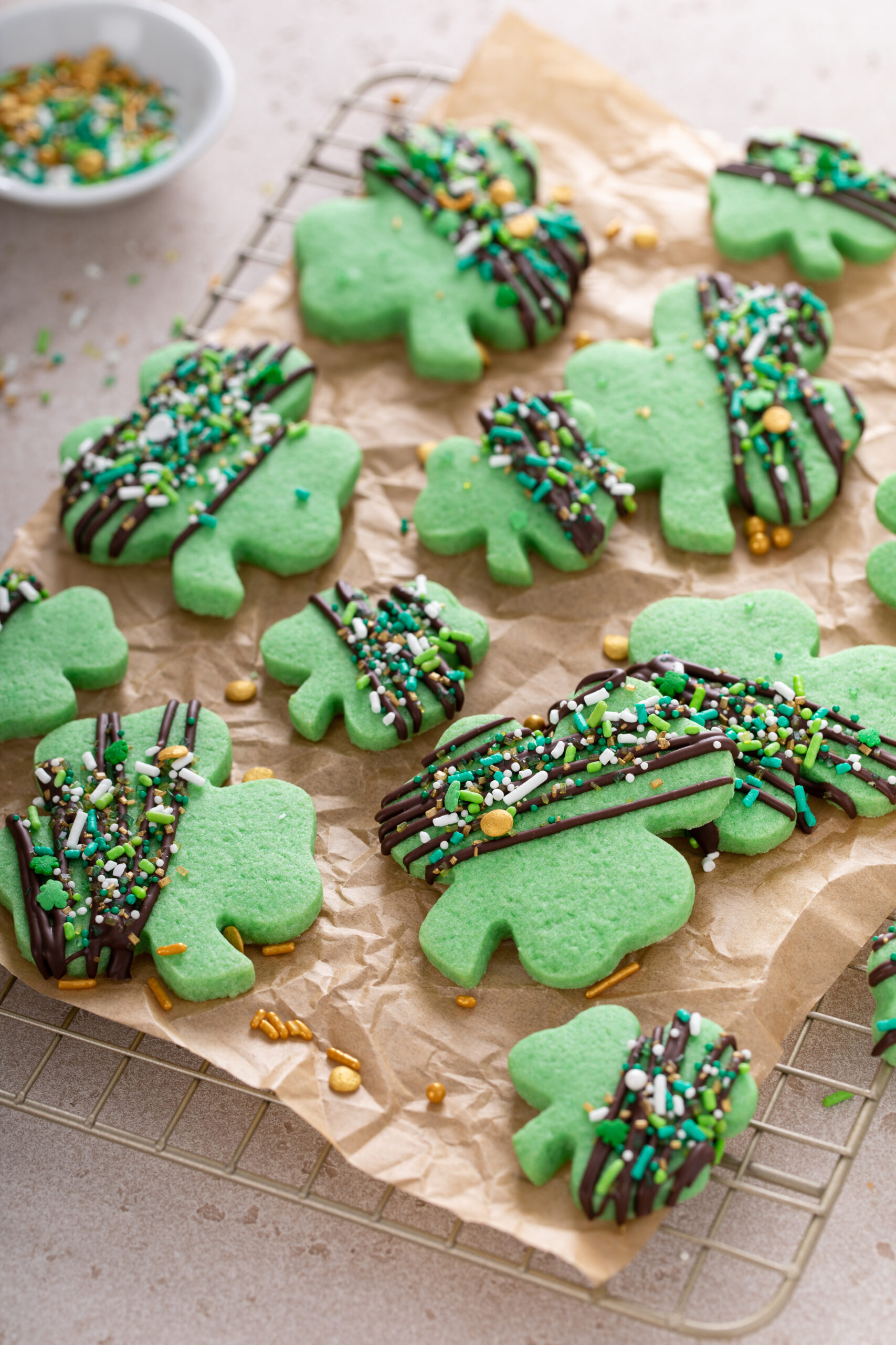 Shamrock cookies with chocolate glaze and sprinkles for St Patricks day - Top 10 St. Patrick's Day Dessert Recipes; St. Patrick's day recipes for desserts along with other green recipes for this Irish holiday!