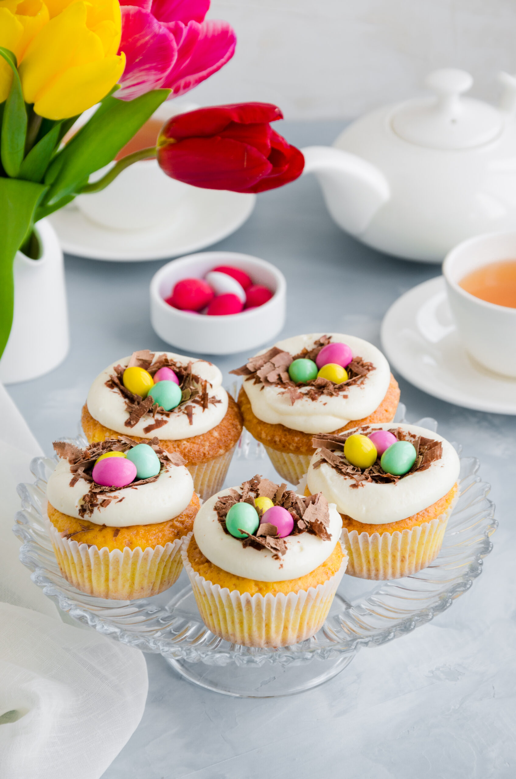 Easter Birds' Nest Vanilla Cupcakes -Easter Birds' Nest Vanilla Cupcakes Recipe; a fun Easter dessert recipe. Delicious fluffy vanilla cupcakes topped with Cadbury mini eggs and shaved chocolate!