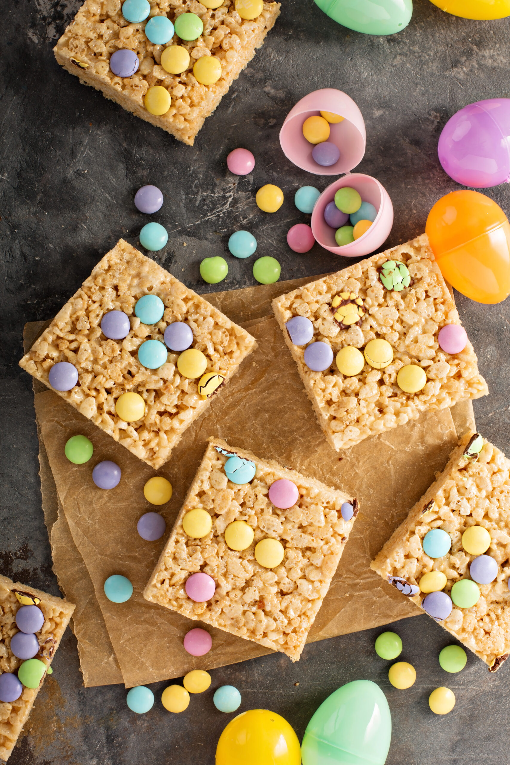 Mini Egg Rice Krispie Squares Recipe; Made with crispy rice cereal, marshmallows, Cadbury mini eggs. These mini egg rice krispie treats are a fun and easy Easter dessert perfect to share with friends or family.