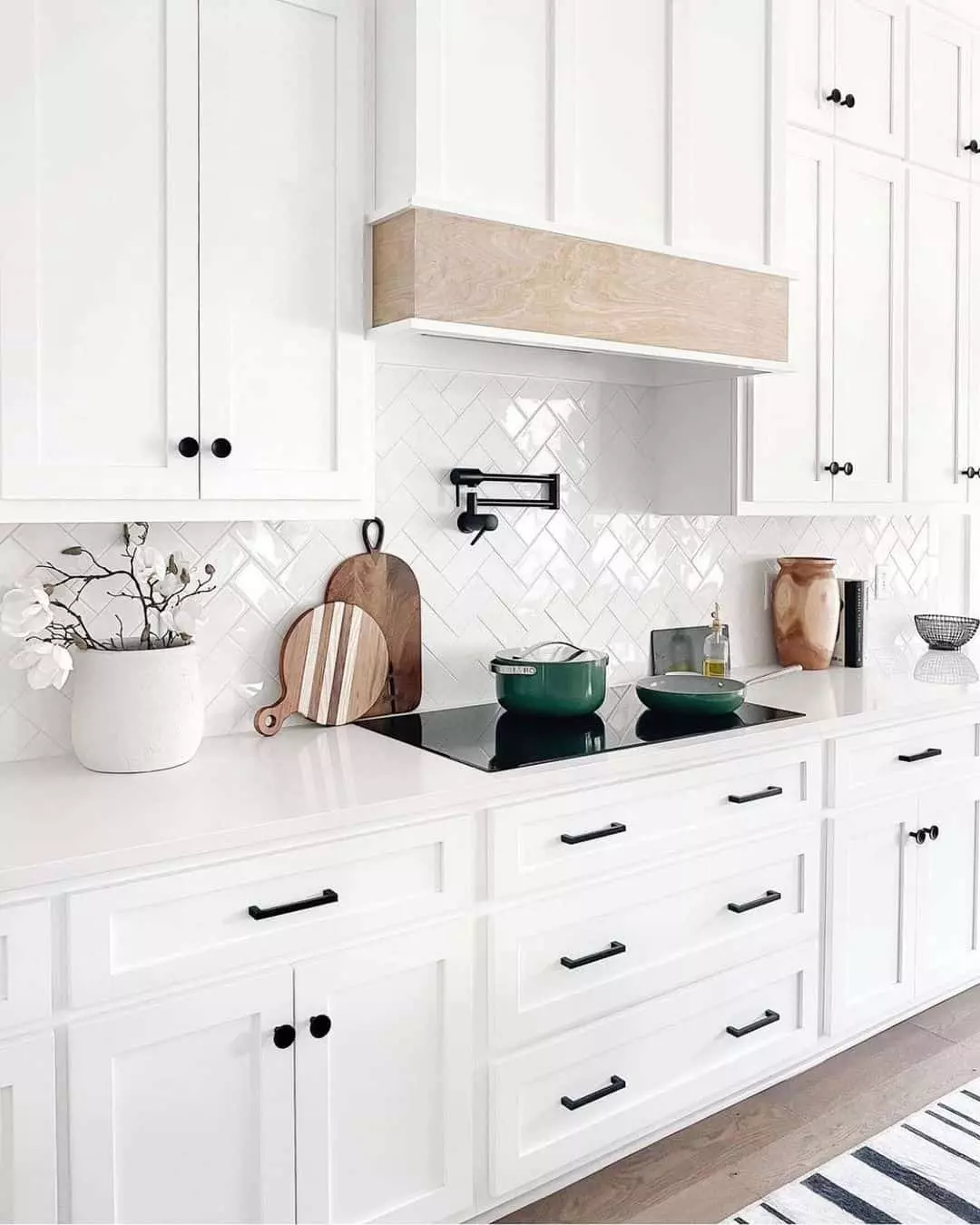 White Herringbone Backsplash Tile Ideas; Modern white herringbone tile ideas. Minimalistic and geometric tiles for your kitchen backsplash!