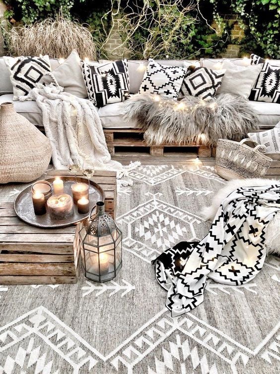Boho Patio Furniture Ideas; Skid furniture with cushions.The bohemian patio furniture ideas in this post include eclectic patio chairs, wicker or rattan furniture, wall decor with rustic appeal, and even boho metal planters for your garden!