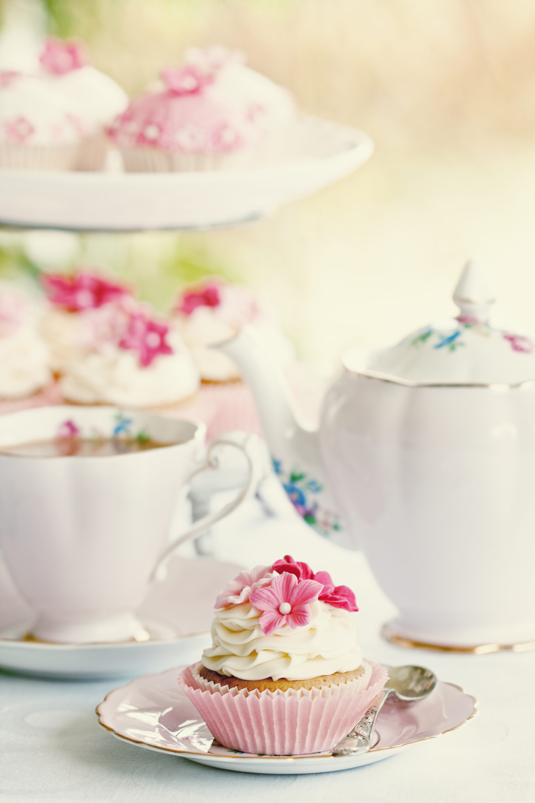 Afternoon tea served with gourmet cupcakes - Hosting the perfect Afternoon Tea Party? We have shared our expert tips to help you plan and organize a lovely gathering.