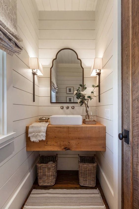 How to Create A Perfect Farmhouse Bathroom; floating vanity, floating wood vanity, white shiplap walls powder room