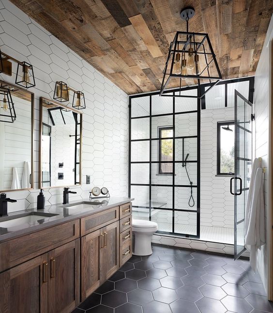 How to Create A Perfect Farmhouse Bathroom; wood ceiling, rustic vanity, black tile, shower, iron light, metal lighting