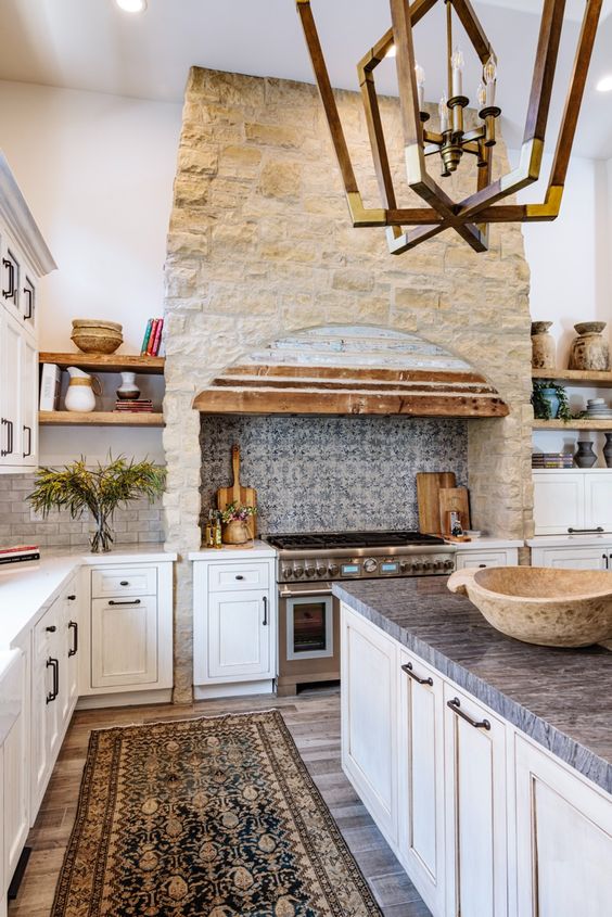 European Cottage Interiors kitchen with brick oven range hood