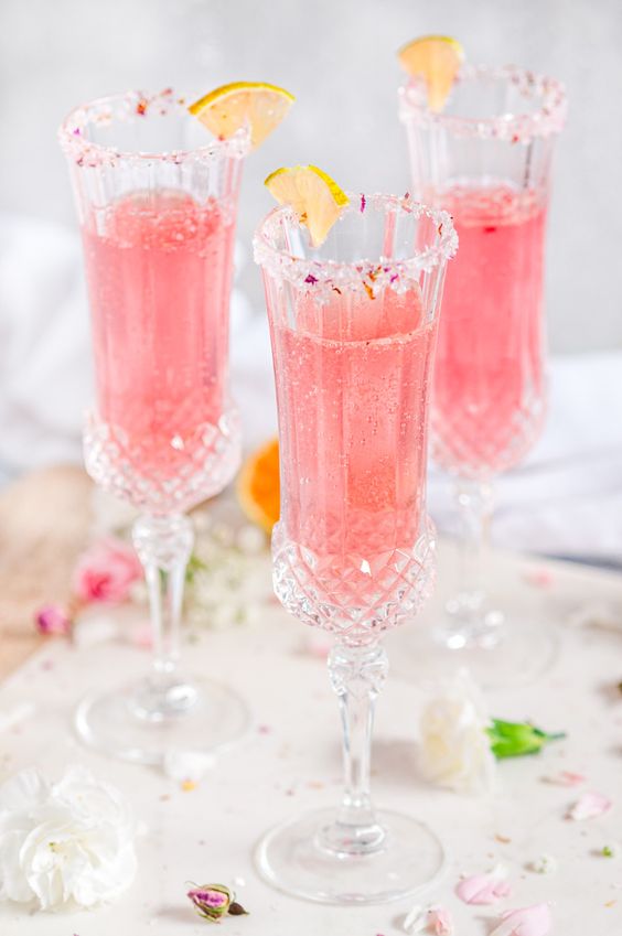 Sparkling Raspberry Rose Spritzer - Looking for some tasty and colorful cocktail inspiration? Look no further than our round-up of the 10 most delicious pink cocktails! From refreshing fruity blends to classic favorites, there's something for every taste in this list. So why not mix things up and try one of these pretty pink drinks at your next gathering?
