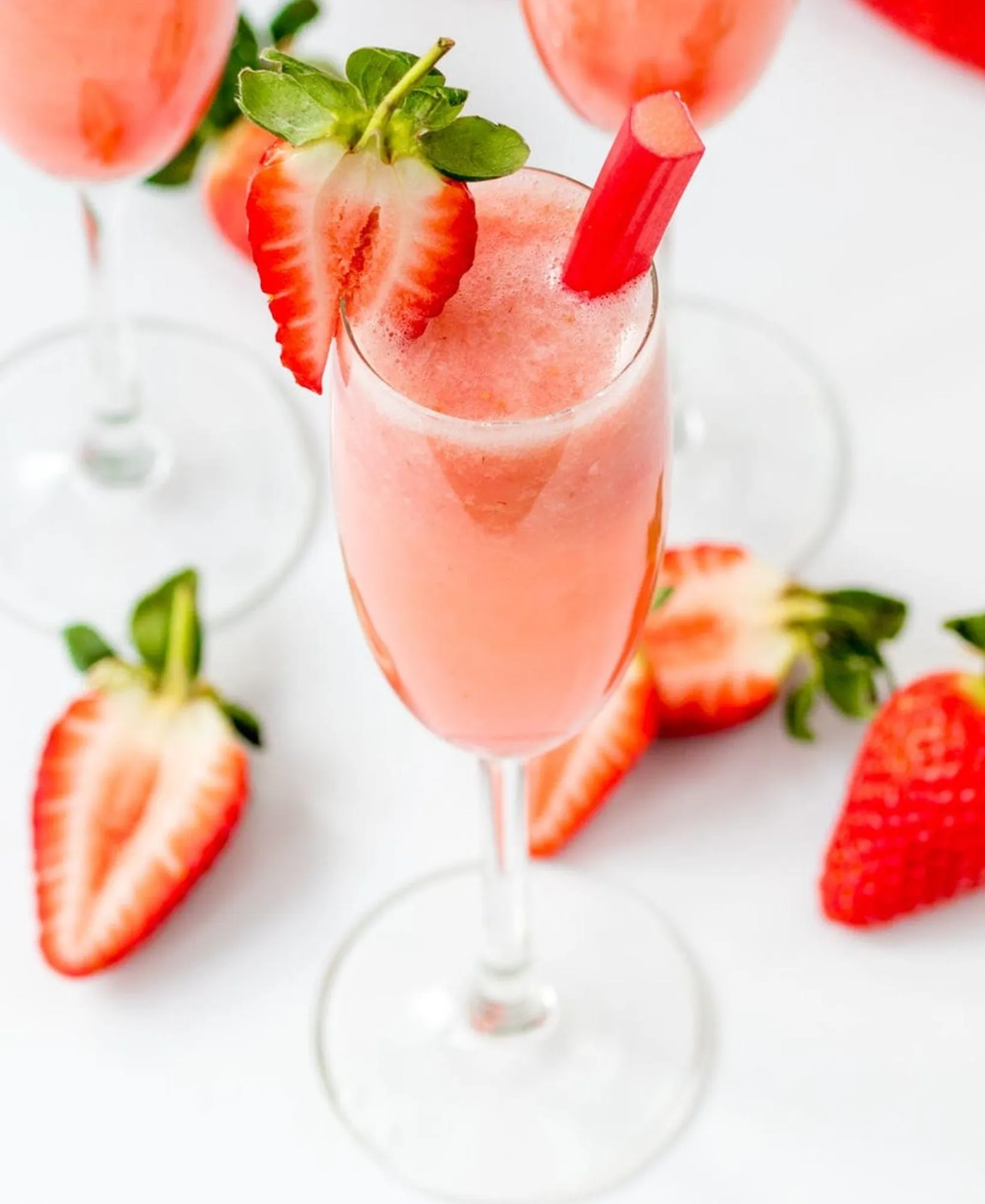 Strawberry And Rhubarb Bellinis- Looking for some tasty and colorful cocktail inspiration? Look no further than our round-up of the 10 most delicious pink cocktails! From refreshing fruity blends to classic favorites, there's something for every taste in this list. So why not mix things up and try one of these pretty pink drinks at your next gathering?