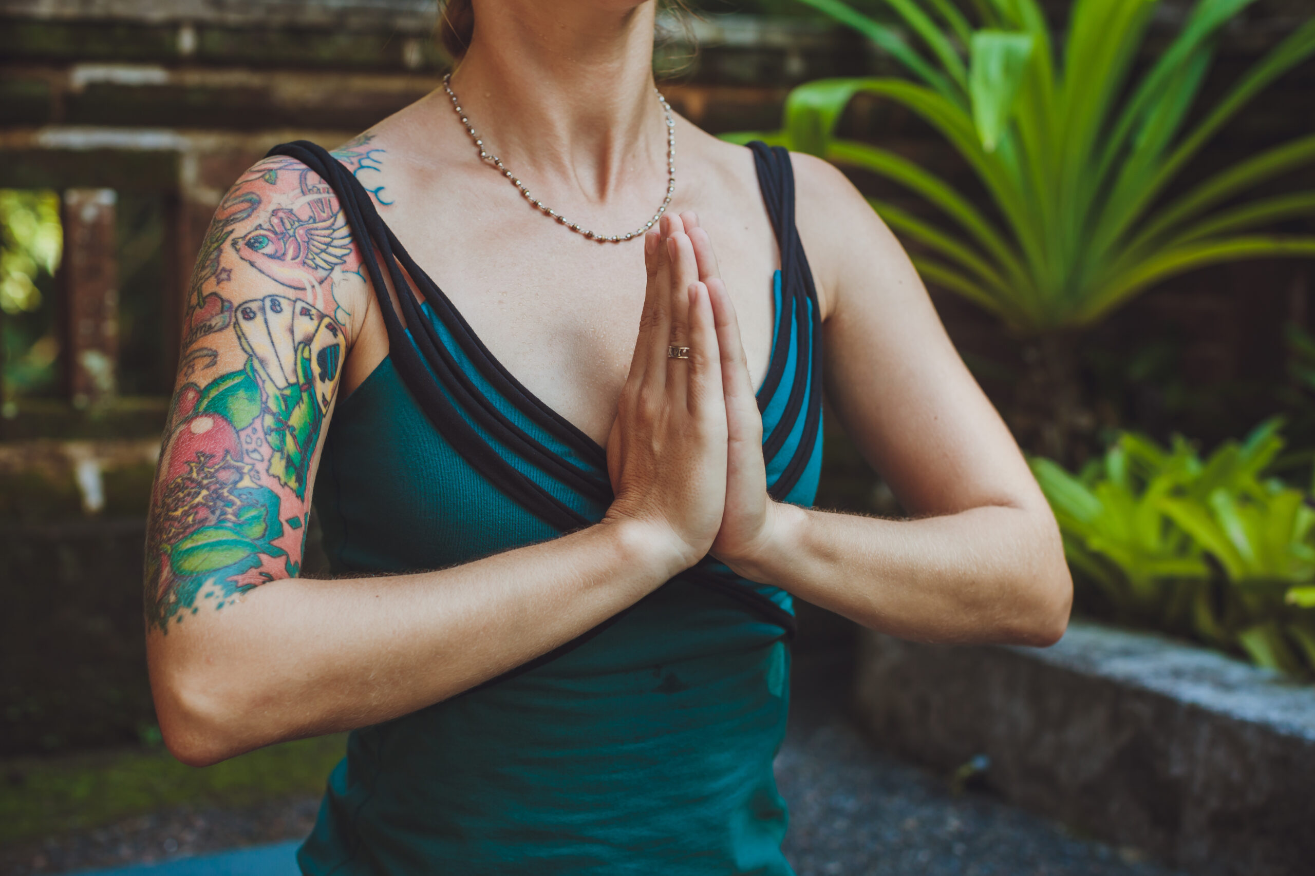 A Young woman doing meditation outdoors in tranquil environment