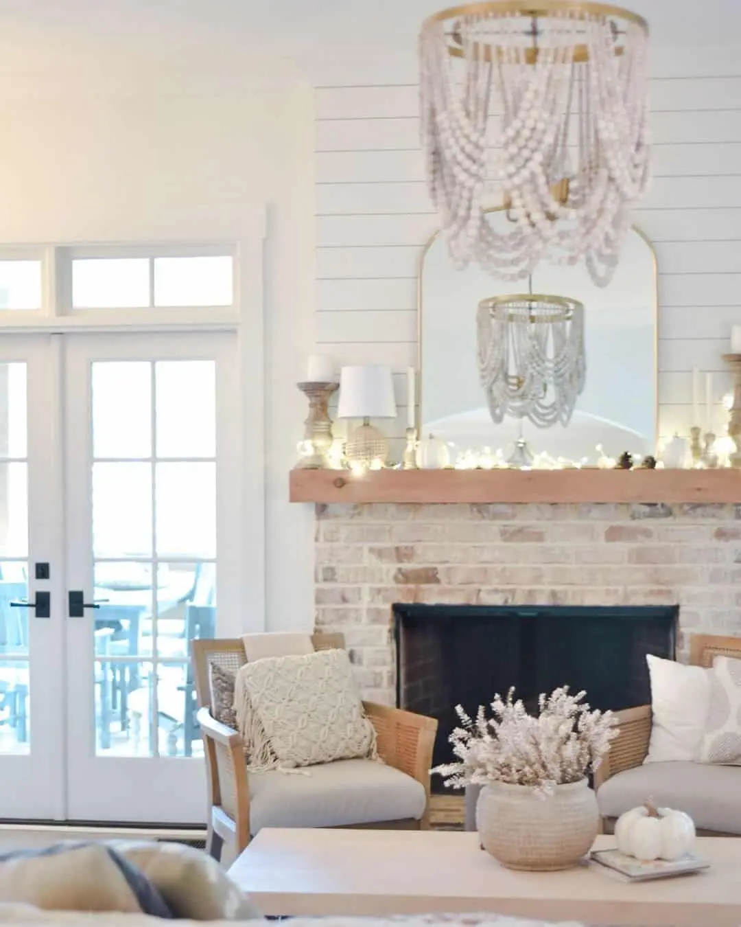 Mirror above fireplace ideas; This large mirror in a sleek brass metal frame is here to steal the show. Its oversized dimensions demand attention, making it the perfect piece to sit proudly on a mantel or lean against the wall. And oh, did we mention its arched design? Talk about adding a touch of timeless elegance!