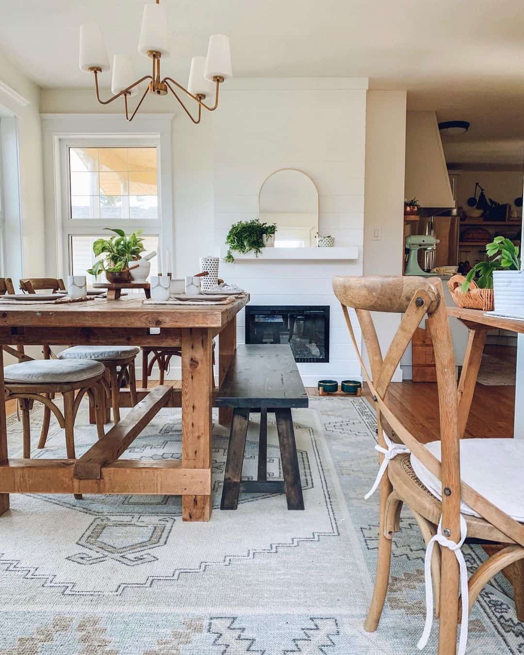 Mirror above fireplace ideas; A sense of farmhouse beauty is captured by the arched mirror placed on a white shiplap fireplace. The simplicity of the white shiplap creates a clean and crisp backdrop, allowing the arched mirror to take center stage. The mirror's elegant arched shape adds a touch of sophistication to the space, while its reflective surface enhances the natural light, creating a bright and airy ambiance. The combination of the arched mirror and white shiplap fireplace creates a harmonious blend of classic yet farmhouse aesthetics, making this photo a stunning example of elegant simplicity.