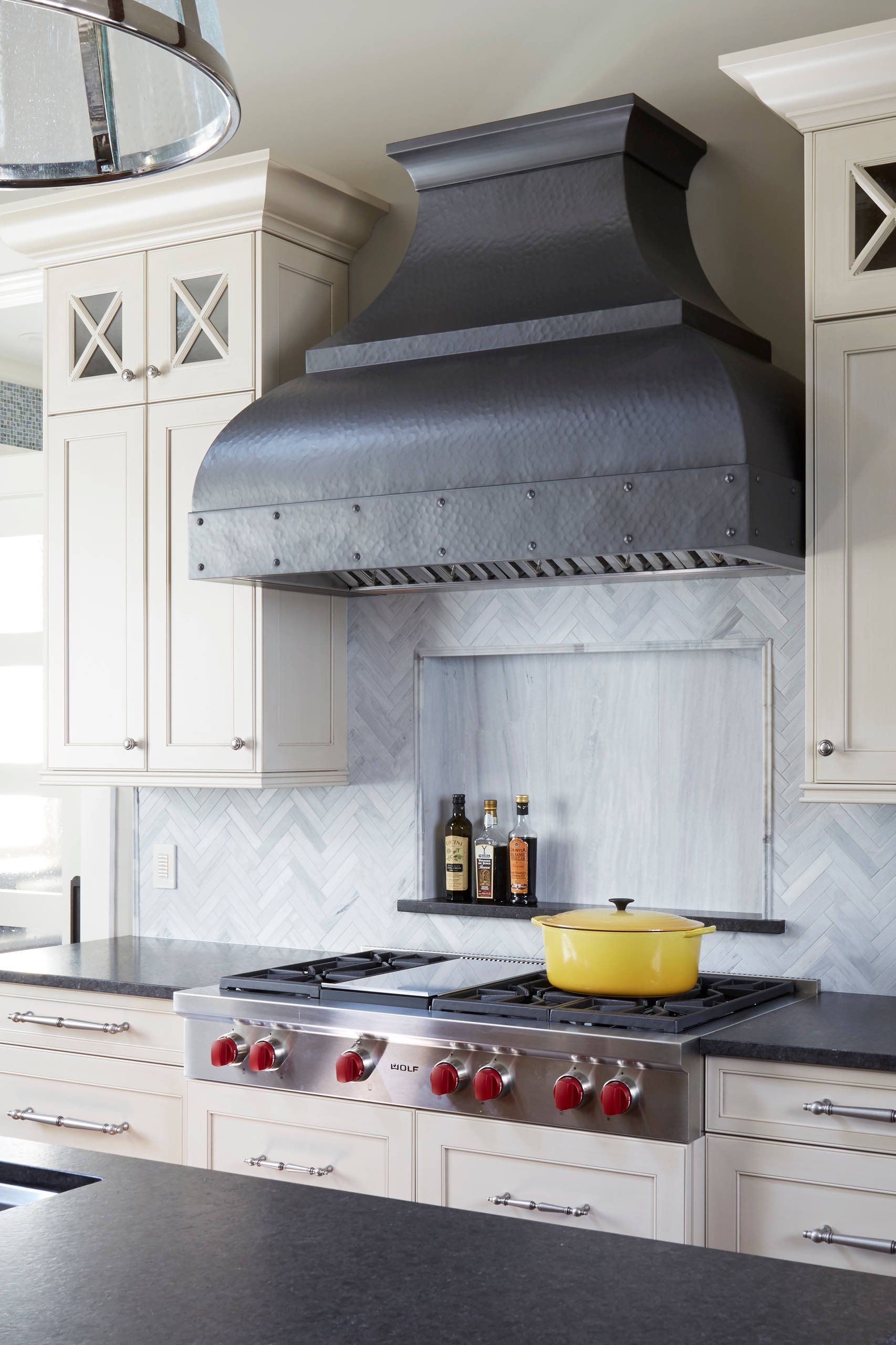 White Cabinets Black Countertops Kitchen Ideas - White Cabinets with Gray Herringbone Backsplash and Industrial Range Hood