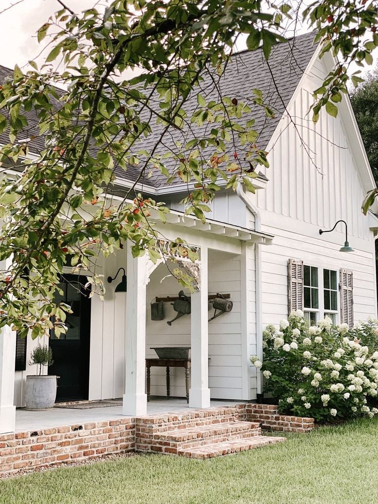 Discover the most stunning white farmhouse exteriors that will inspire your next home renovation project. From charming country cottages to grand manor houses, explore my curated list of the top 25 white farmhouse exteriors that you absolutely need to see. Find your dream style and get inspired to create a timeless, elegant, and inviting home!!
