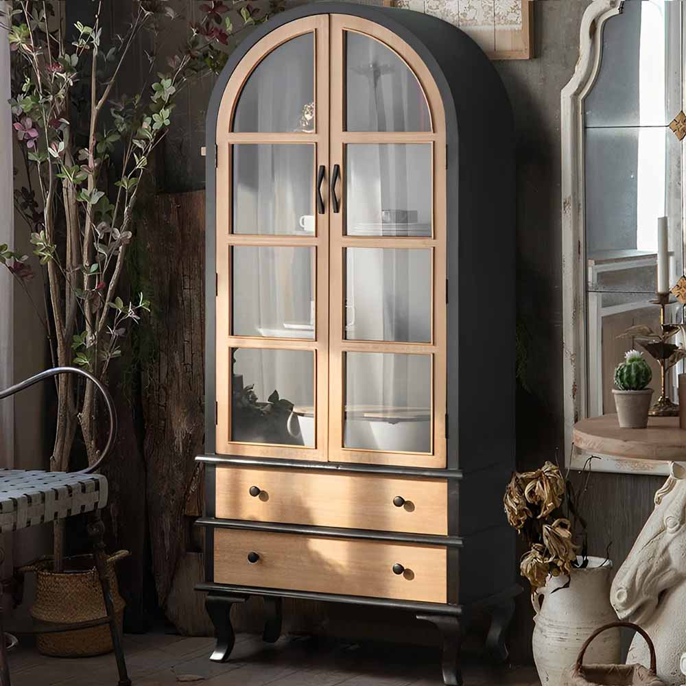 Boasting an alluring arched silhouette, this gorgeous arched cabinet promises to add an element of elegance to any part of your home. The delightfully designed curved top and doors command attention, making it a chic centrepiece, be it in your dining room, kitchen, living room or office space. Behind its stylish doors lays ample storage, providing a neat, organized place for your dining ware, pantry items, favourite reads or precious decorative pieces. Sized at 29.1'' W X 69'' H X 14.1'' D, it certainly stands tall in its purpose and versatility. And to wrap it up in a bow, it's available in two evergreen shades - a deluxe black or a pristine white.