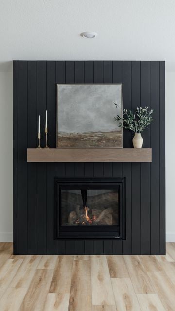 15 Black Shiplap Fireplace Ideas for a Moody Vibe; A stylish black shiplap fireplace adding a modern and elegant touch to the room.