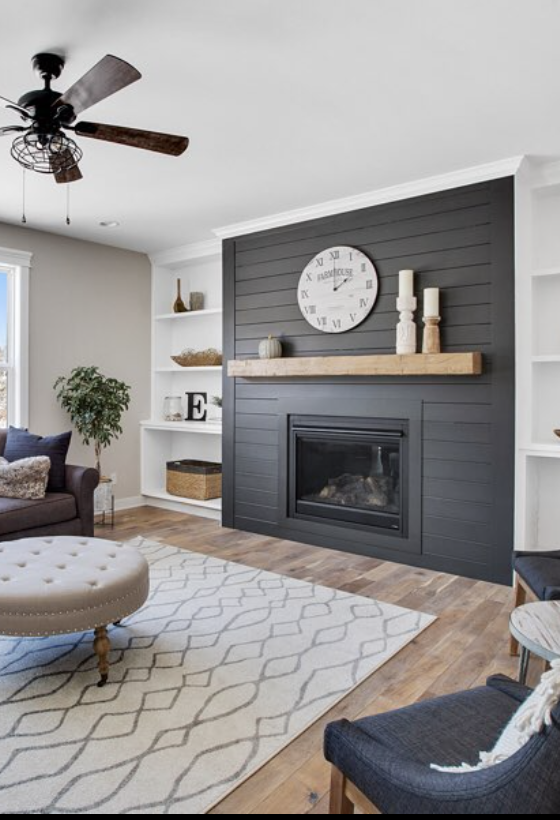 15 Black Shiplap Fireplace Ideas for a Moody Vibe; A stylish black shiplap fireplace adding a modern and elegant touch to the room.