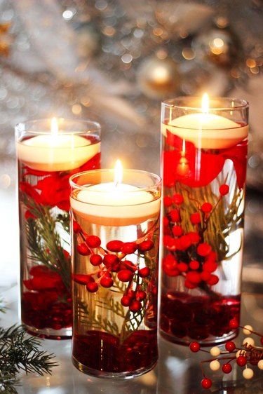 15 Festive Christmas Floating Candles - Lighten up your holiday season with these cozy Christmas Floating Candles ideas and more! From small arrangements to grand centerpieces, there is a look for everyone! Dive in to find the perfect combination of Christmas sparkle and candlelight magic!
