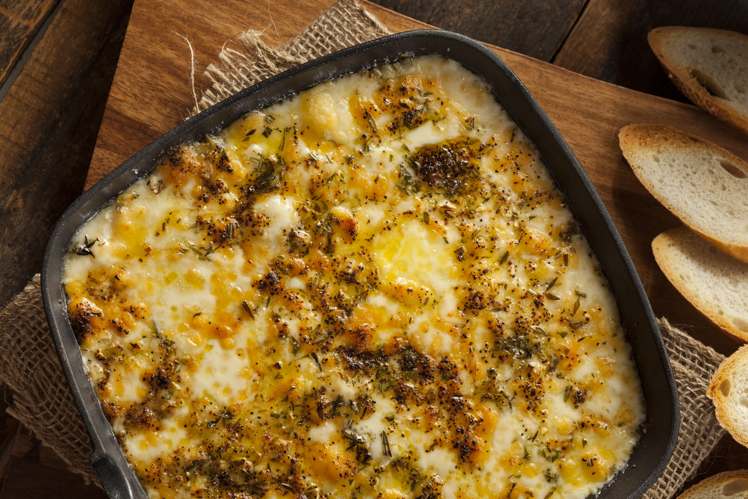 Baked Fontina Cheese Dip - an unforgettable Italian inspired appetizer recipe. Perfectly melted Fontina cheese, seasoned with aromatic herbs, served hot and delicious. Party-perfect, easy to make, and irresistibly creamy!
