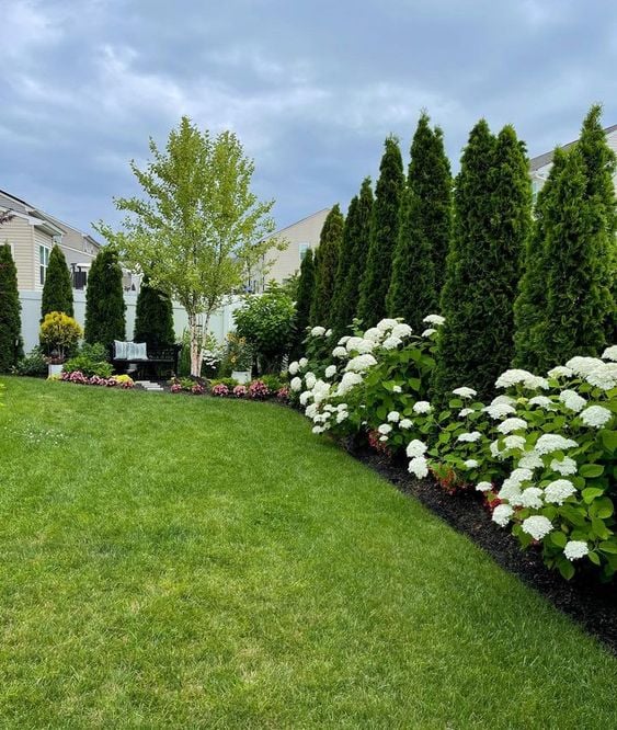 Discover 15 innovative and tranquil landscaping ideas here! From serene garden spaces to vibrant floral arrangements, transform your outdoor living space into a natural sanctuary. Begin your journey towards a breathtaking backyard today!