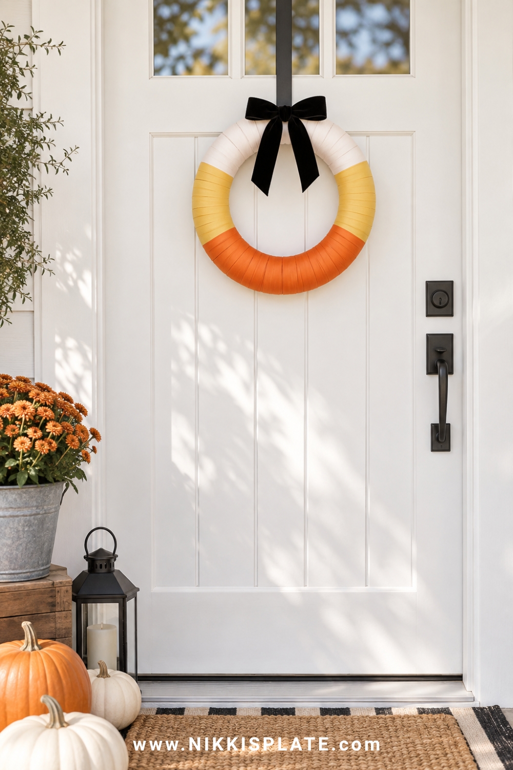 Foam Halloween wreath wrapped in white, orange and yellow ribbon like candy corn