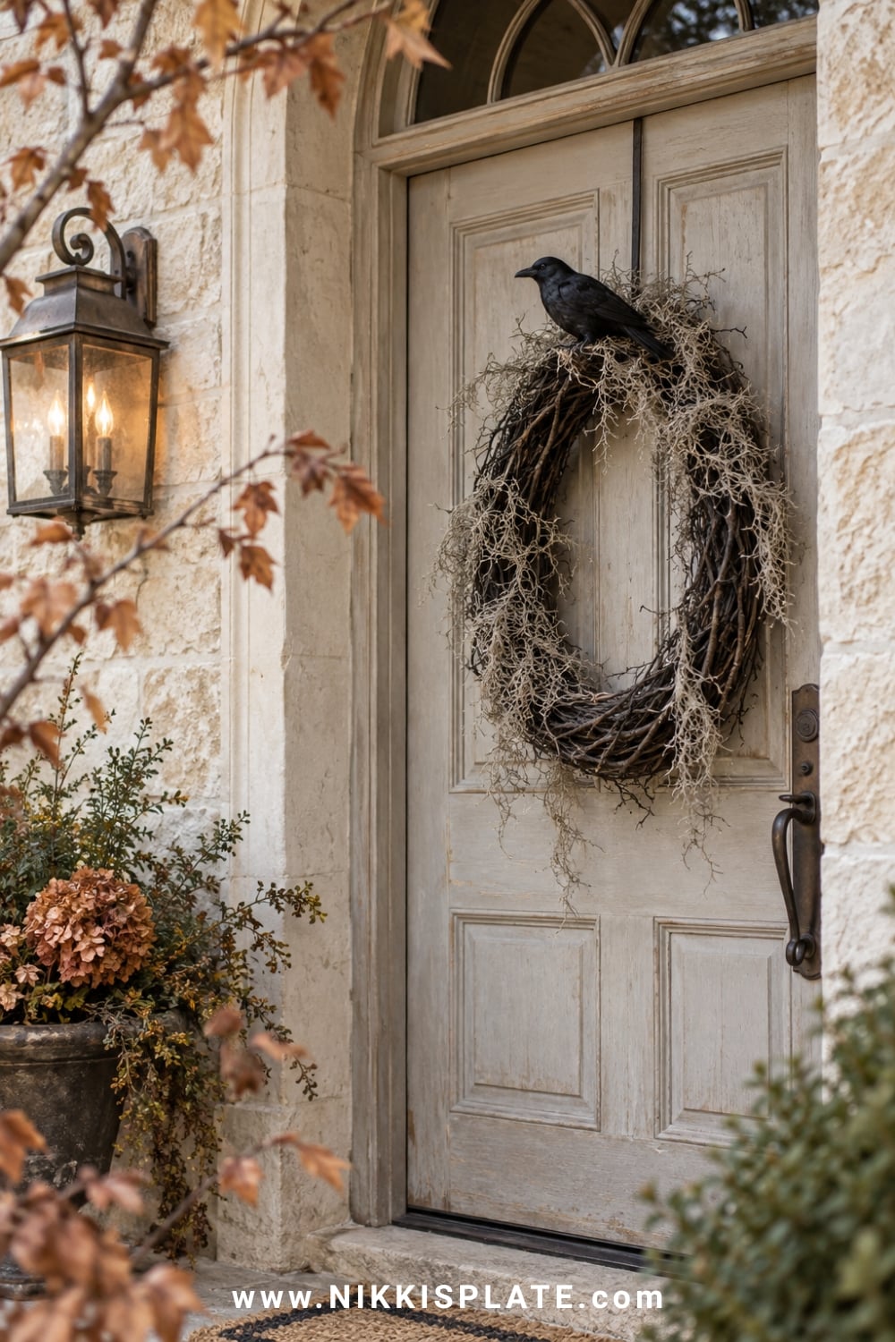 Oval black grapevine Halloween wreath with Spanish moss and a faux crow