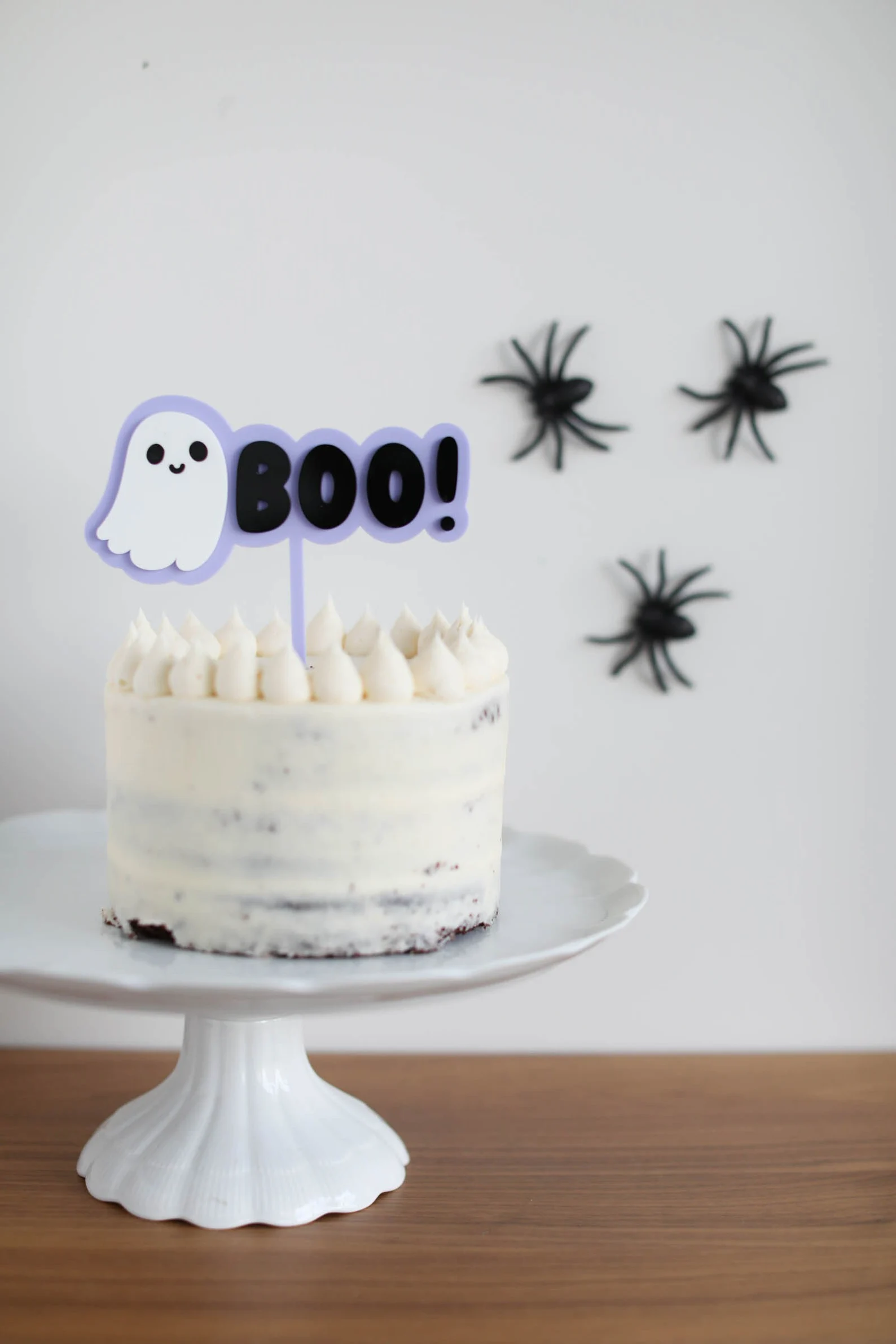 Minimalist white cake with a cute ghost