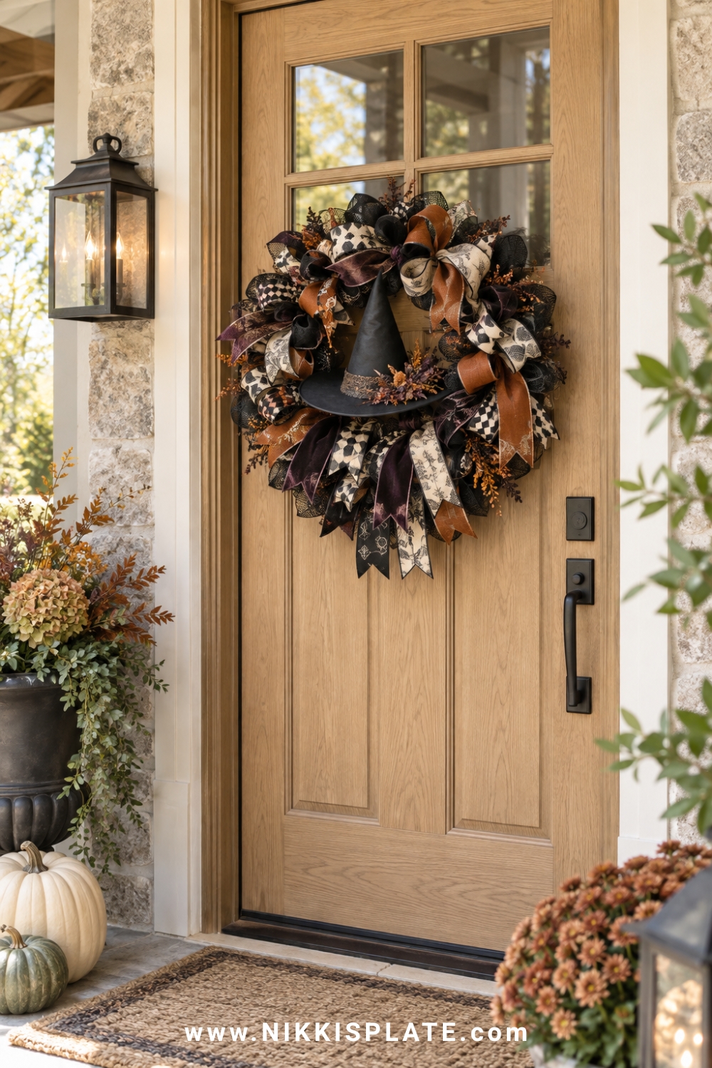 Black, rust, cream and purple ribbon wreath with a small witch hat