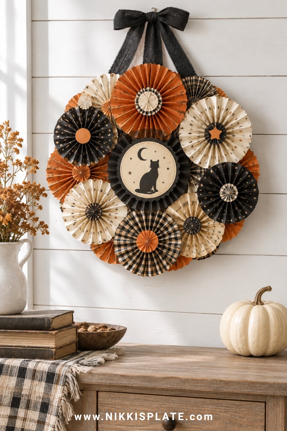 Vintage Halloween paper fan wreath in faded orange, cream and black