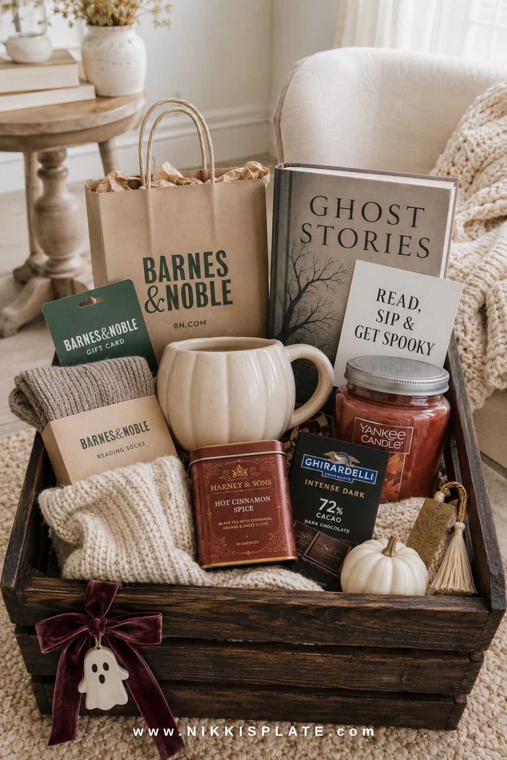 Barnes & Noble book lover boo basket with Ghost Stories, tea, dark chocolate, a pumpkin mug and cozy reading accessories.