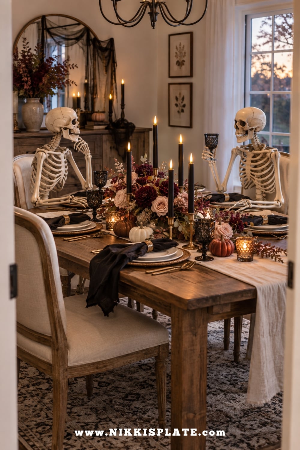 Two skeleton guests seated at an elegant Halloween dining table with flowers and LED candles