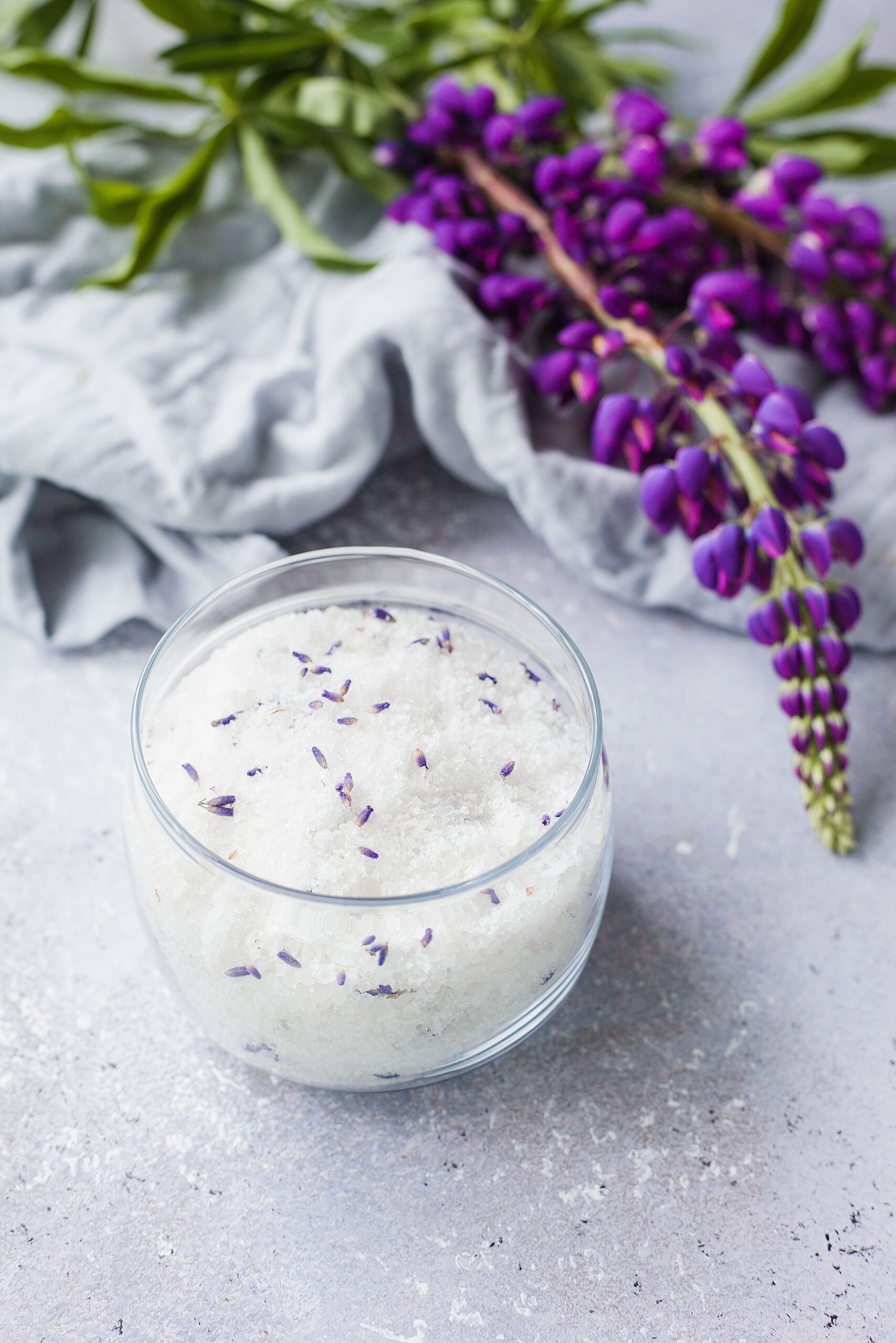 Learn how to make a DIY lavender salt scrub with this easy recipe using natural ingredients. Exfoliate, moisturize, and relax with this soothing homemade skincare essential!