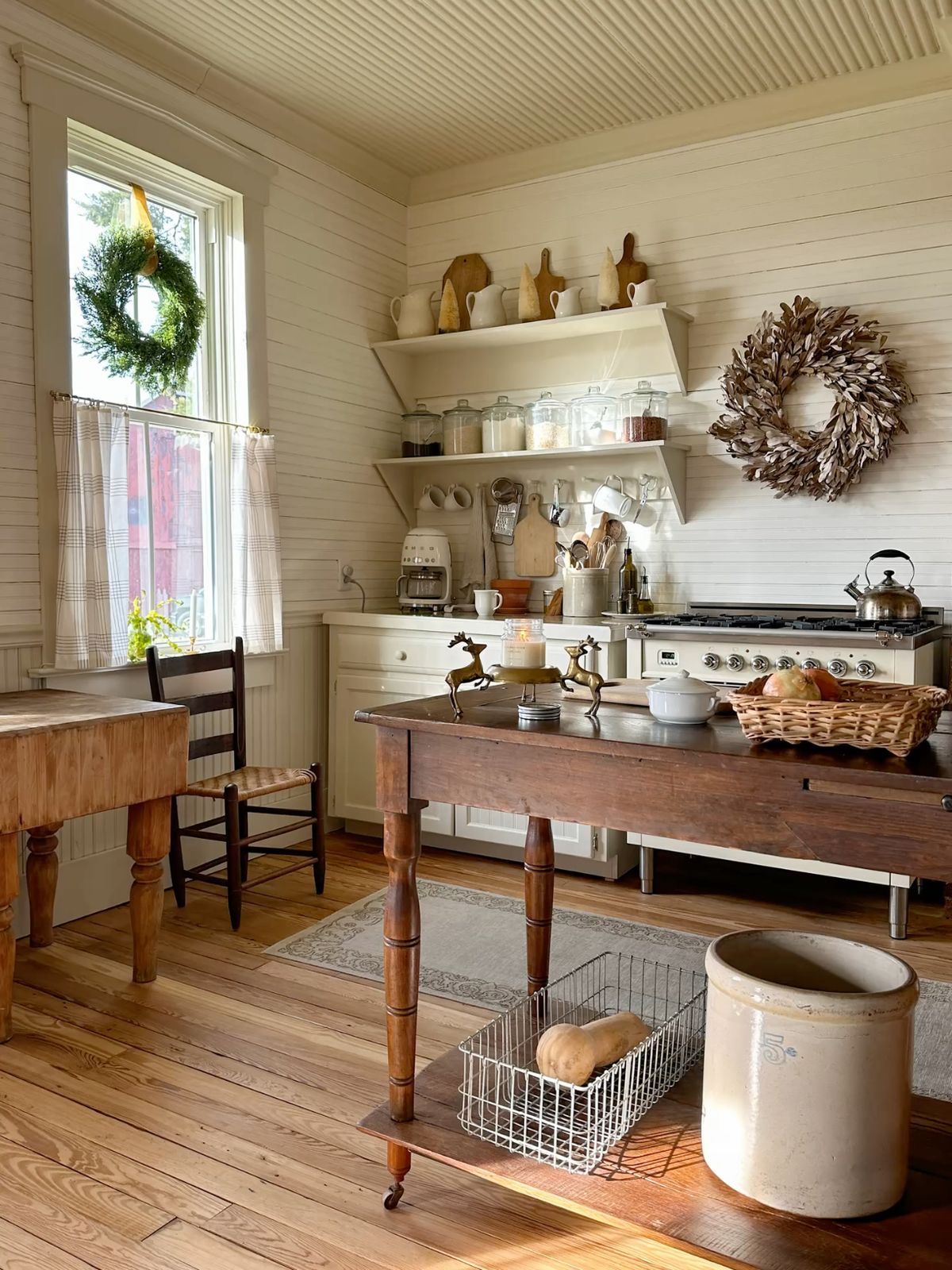 Vintage rolling pins and wooden spoons displayed on open shelves for a fall grandmacore kitchen.