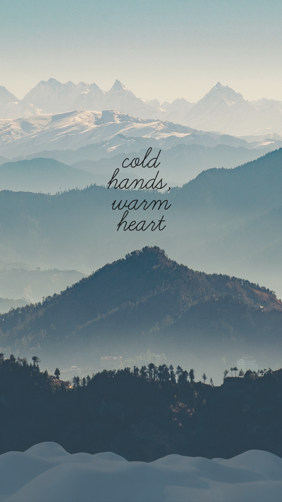 Snowy mountain landscape with soft blue tones and winter quote overlay: 