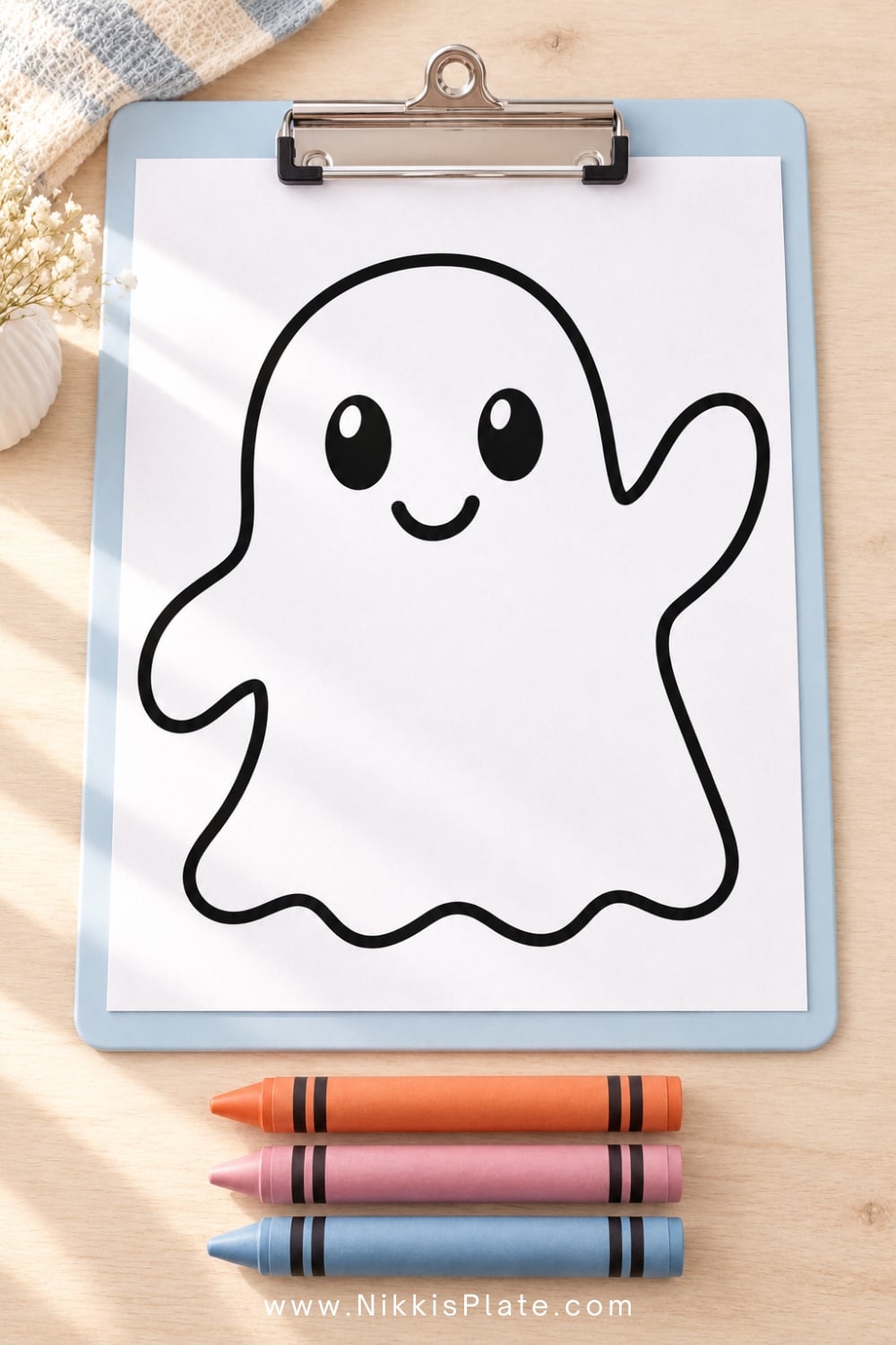 Close-up of a simple ghost coloring page with thick black outlines and large open spaces for toddlers.
