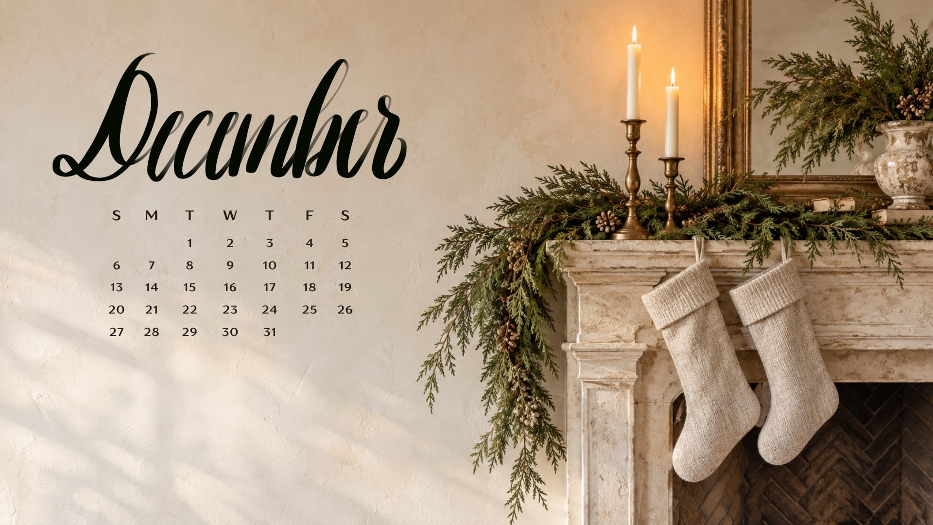 December 2026 desktop calendar with evergreen garland, brass candleholders and linen stockings on a cream fireplace mantel.