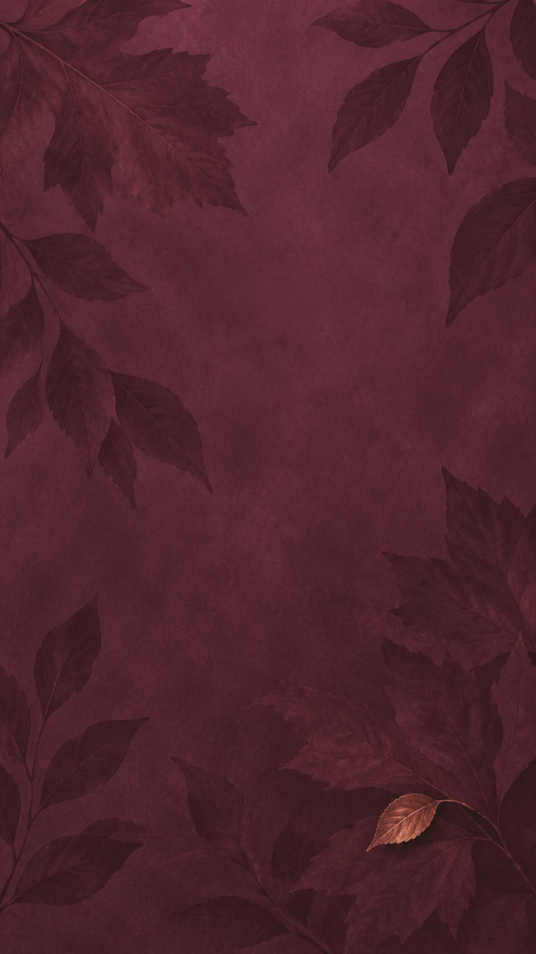 Dark minimalist fall iPhone wallpaper with subtle plum leaf silhouettes on a deep burgundy background.