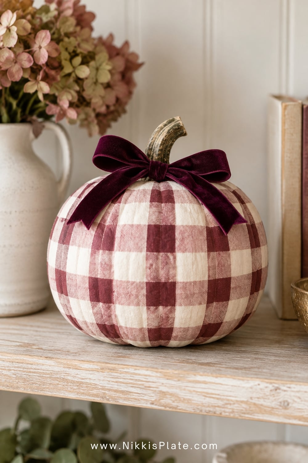 Blush and burgundy gingham painted pumpkin with a velvet stem bow.