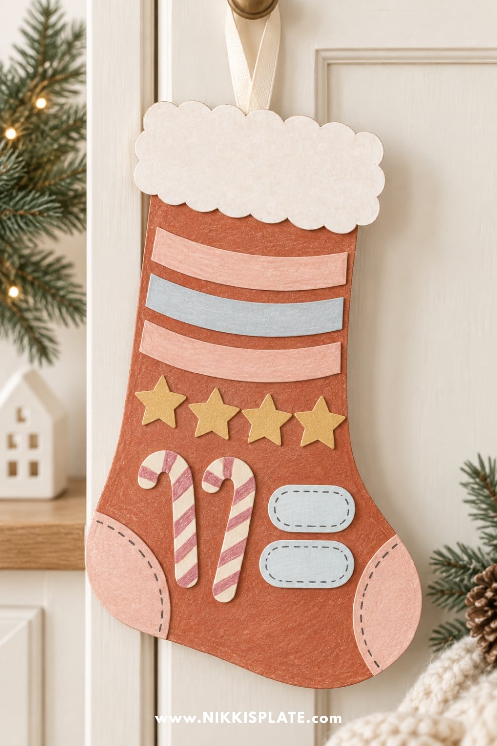 Finished printable Christmas stocking craft for kids decorated with colorful paper details