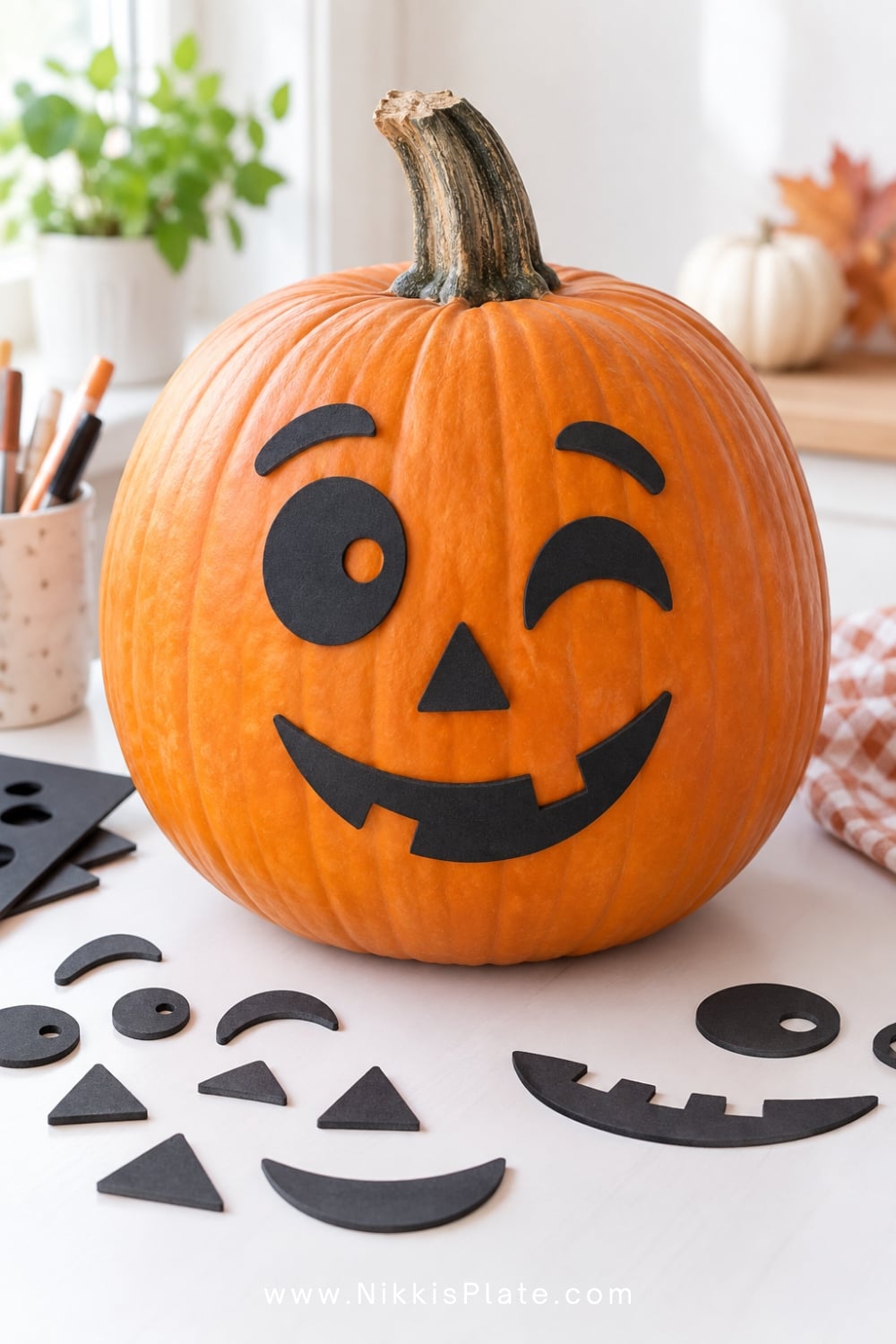Orange pumpkin with removable black sticker eyes, noses and silly mouths.