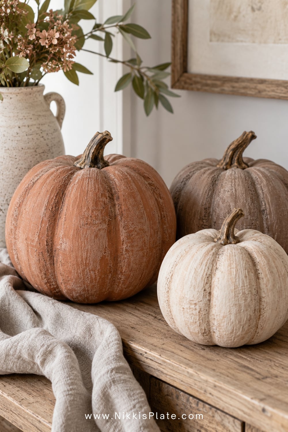 Faux pumpkins with textured terracotta, mushroom and cream painted finishes.