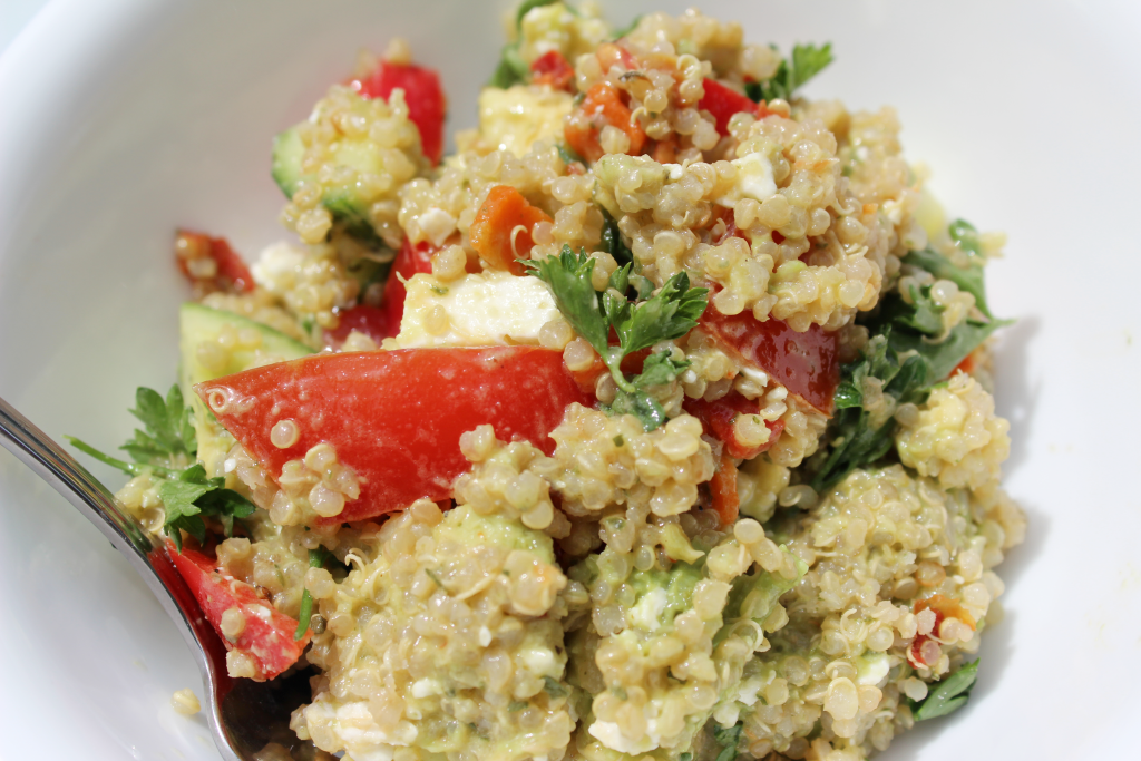 Avocado Greek Quinoa Salad with Lemon Dijon Dressing. Tomatoes, cucumber, parsley and red pepper.